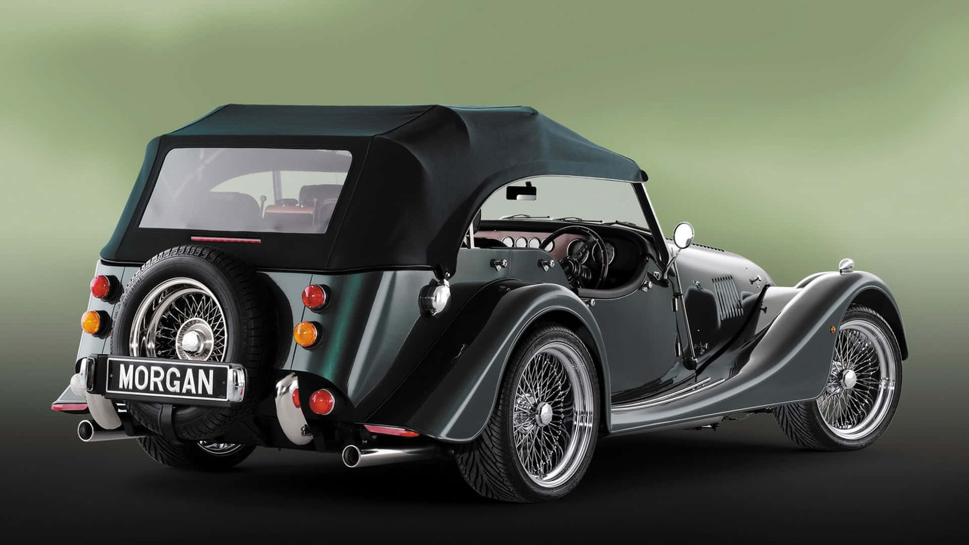 Caption: Elegant Morgan Roadster In Dynamic Pose Wallpaper