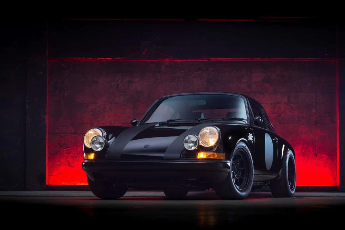 Caption: Elegant Porsche 964 Gleaming Under City Night Lights Wallpaper