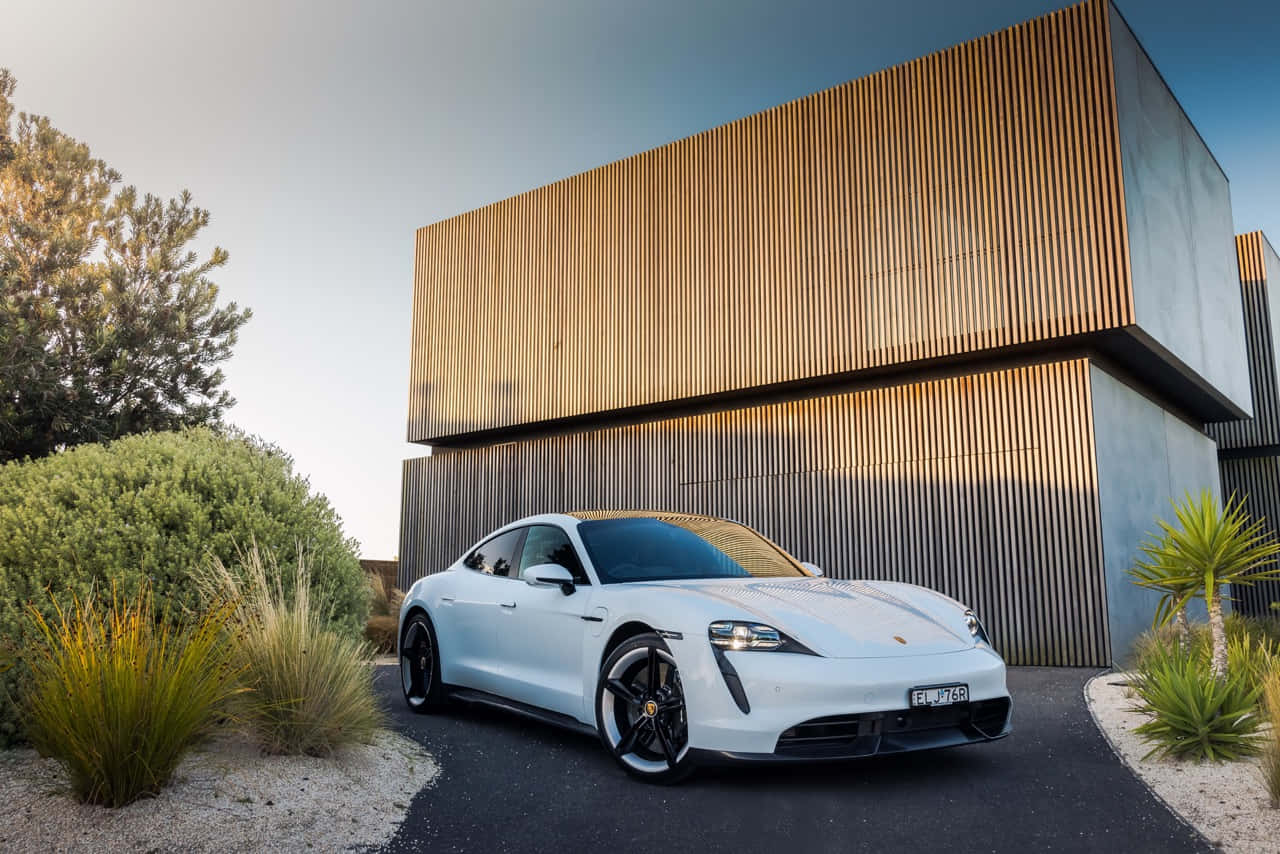 Caption: Elegant Porsche Taycan In Full Glory Wallpaper