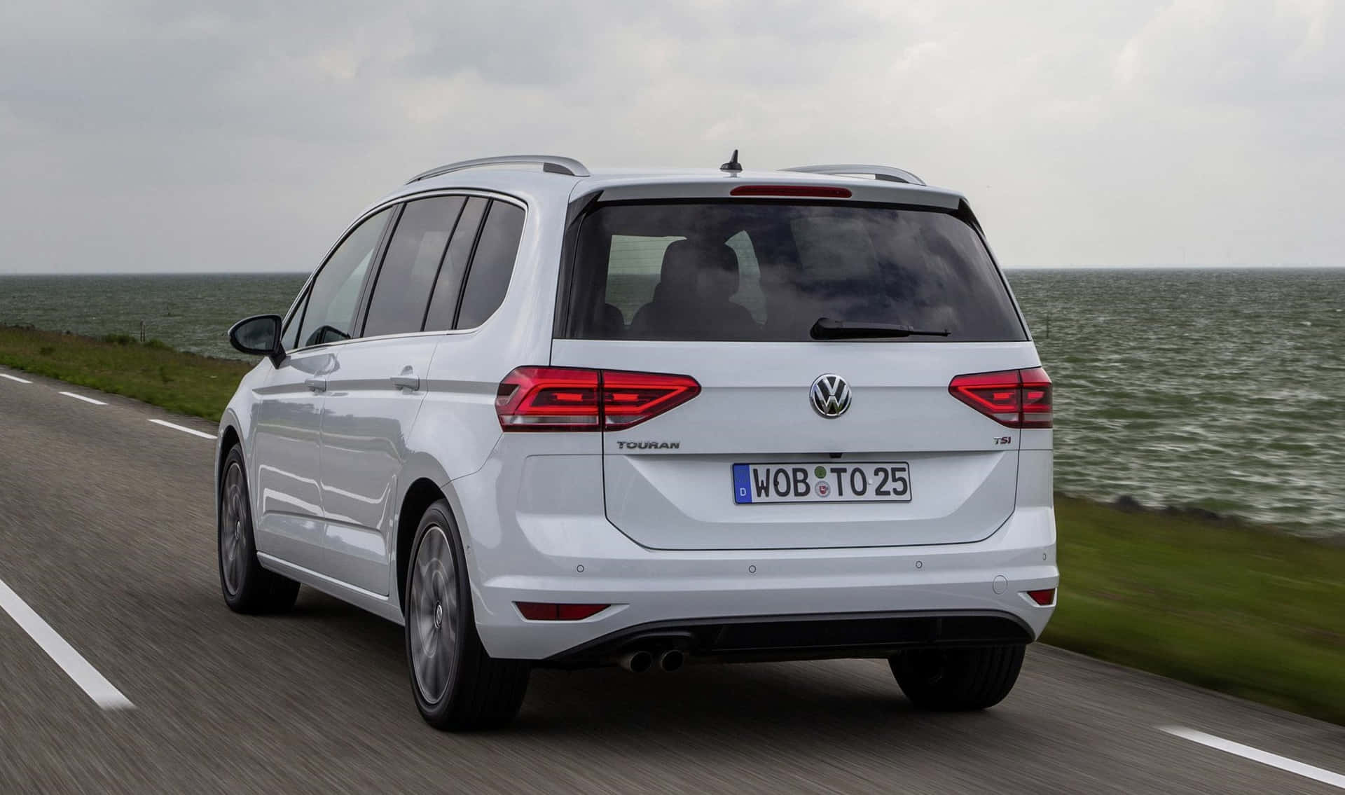 Caption: Elegant Volkswagen Touran Road-tripper Wallpaper