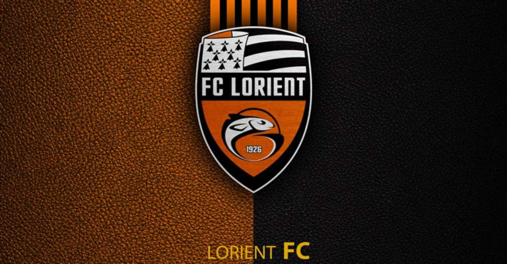 Caption: Fc Lorient Players Celebrating Victory Wallpaper