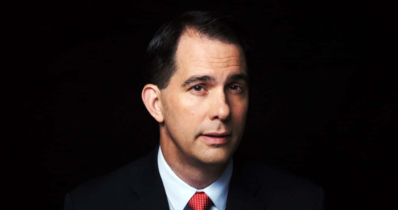 Caption: Former Wisconsin Governor, Scott Walker, In A Casual Stance. Wallpaper