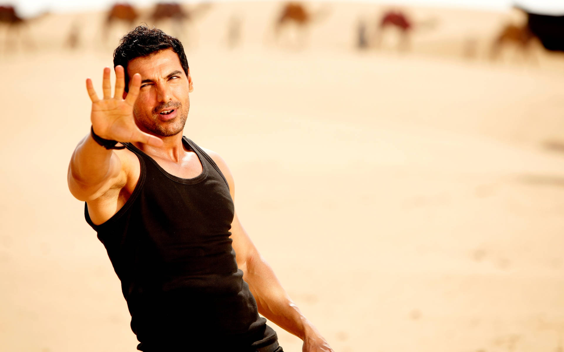 Caption: Handsome Bollywood Superstar John Abraham Looking Radiantly Confident Wallpaper