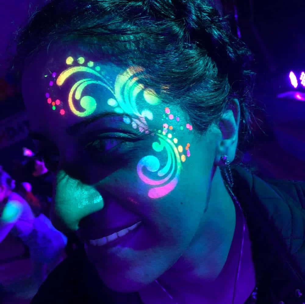 Caption: Infusing Art And Beauty With Neon Makeup In Black Light Wallpaper