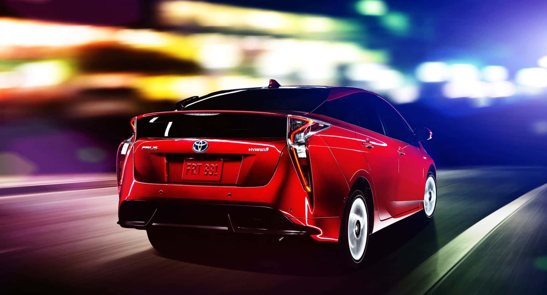 Caption: Innovative Eco-friendly Sedan: The Toyota Prius Wallpaper