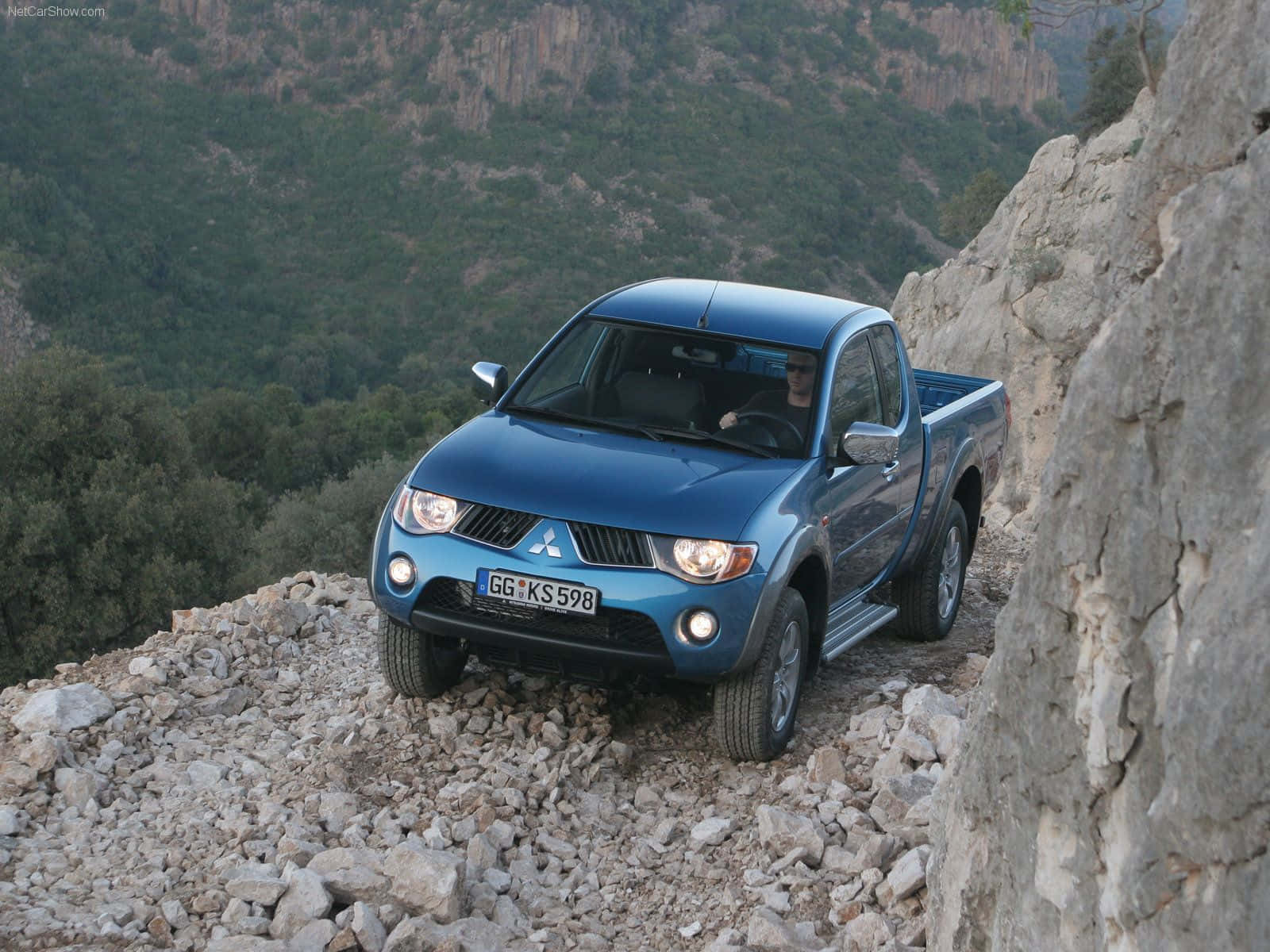 Caption: Intrepid Mitsubishi Triton Dominating The Wilderness Wallpaper