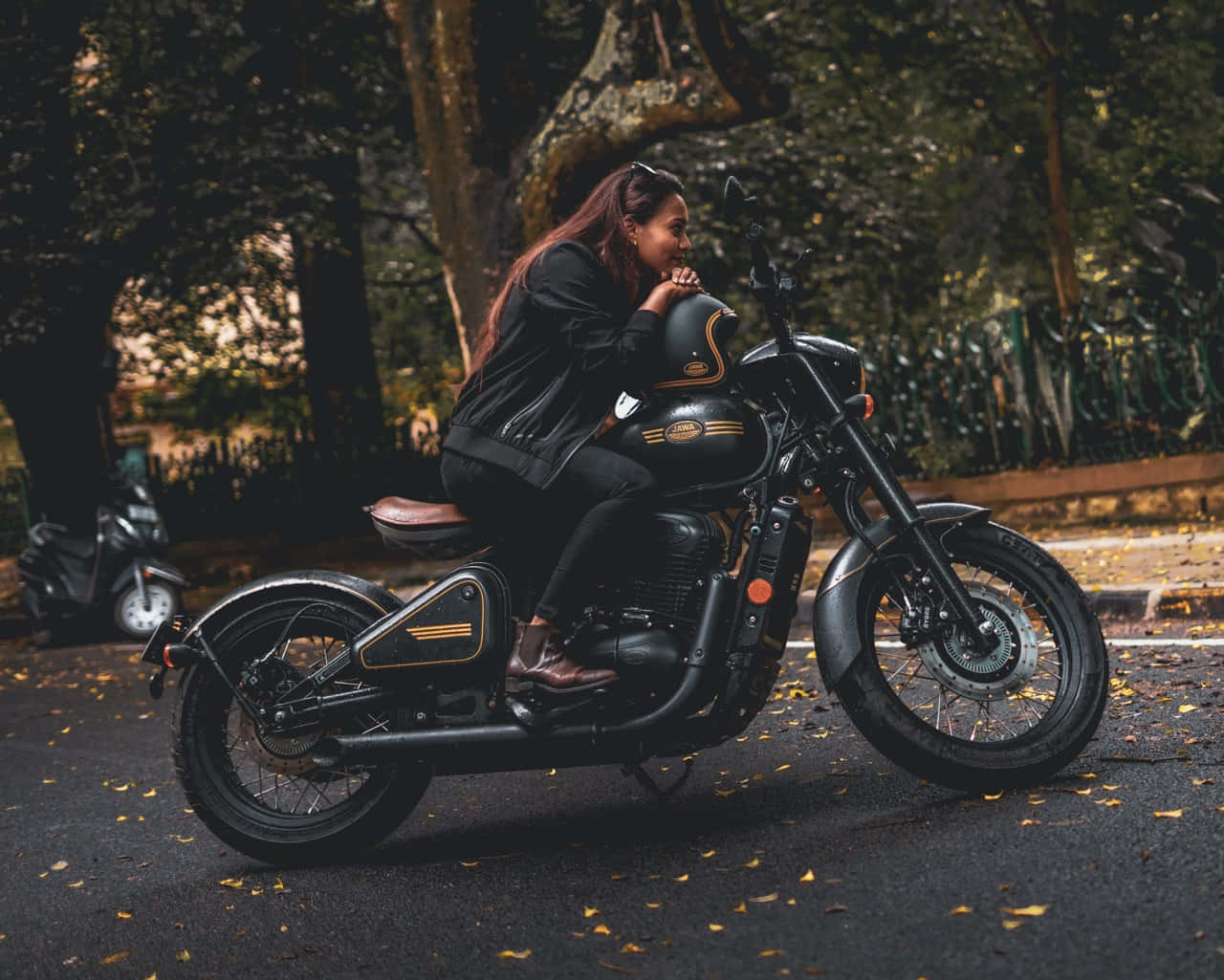 Caption: Jawa Motorcycle Riding On A Country Road Wallpaper