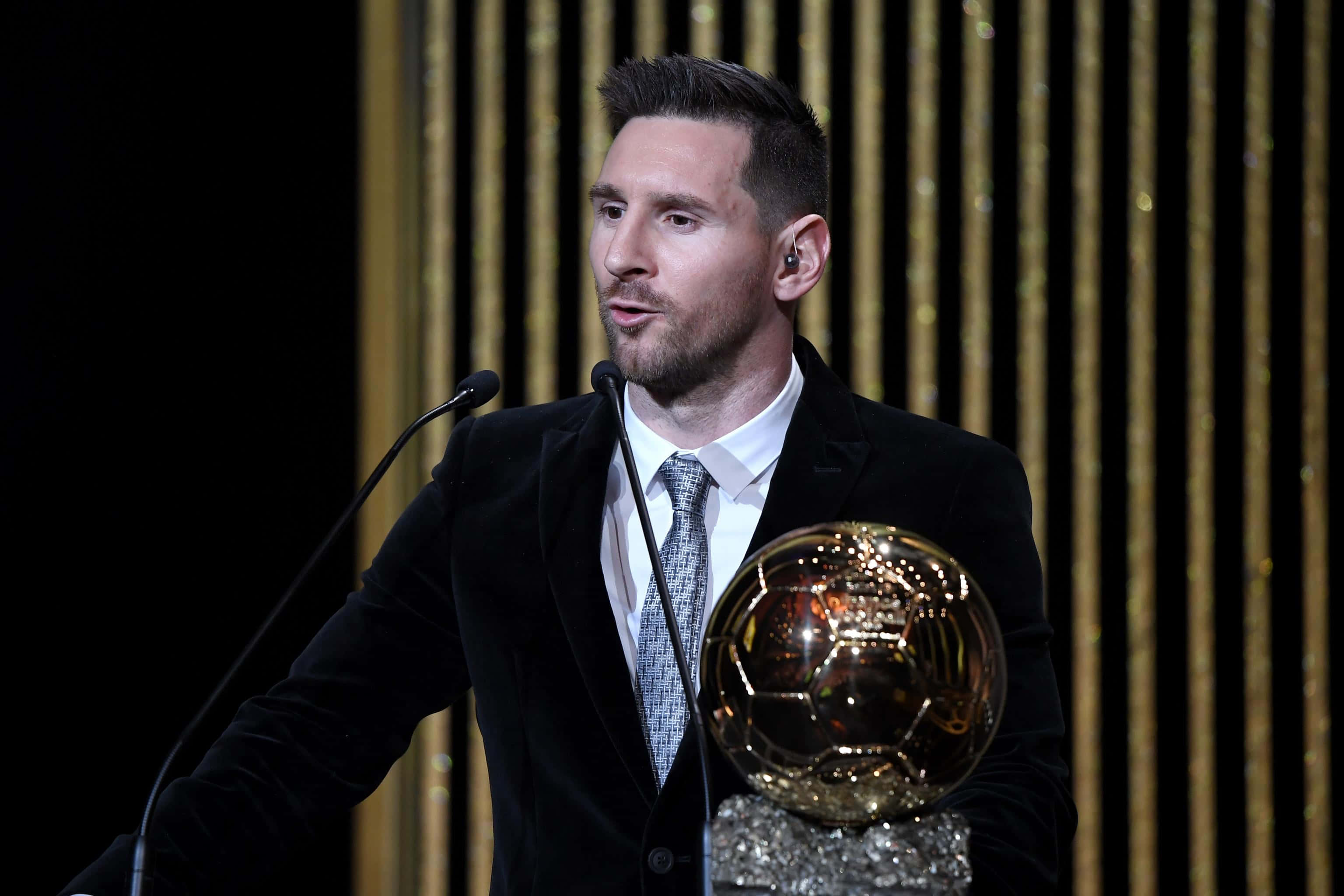 Caption: Lionel Messi With Ballon D'or Trophy, Proving His Excellence Once Again. Wallpaper