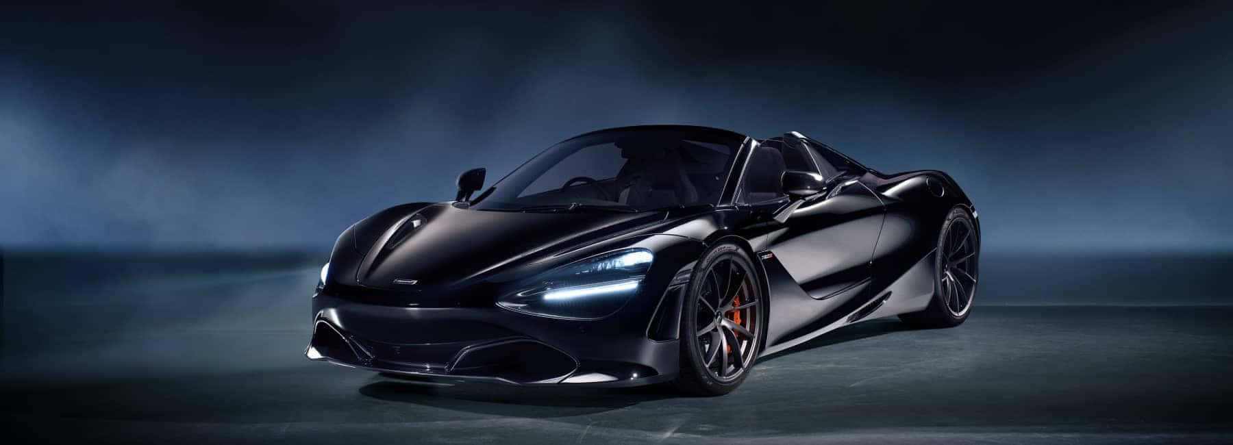 Légende : Mclaren 720s Spider Luxueuse Sur Une Route Immaculée Fond d'écran