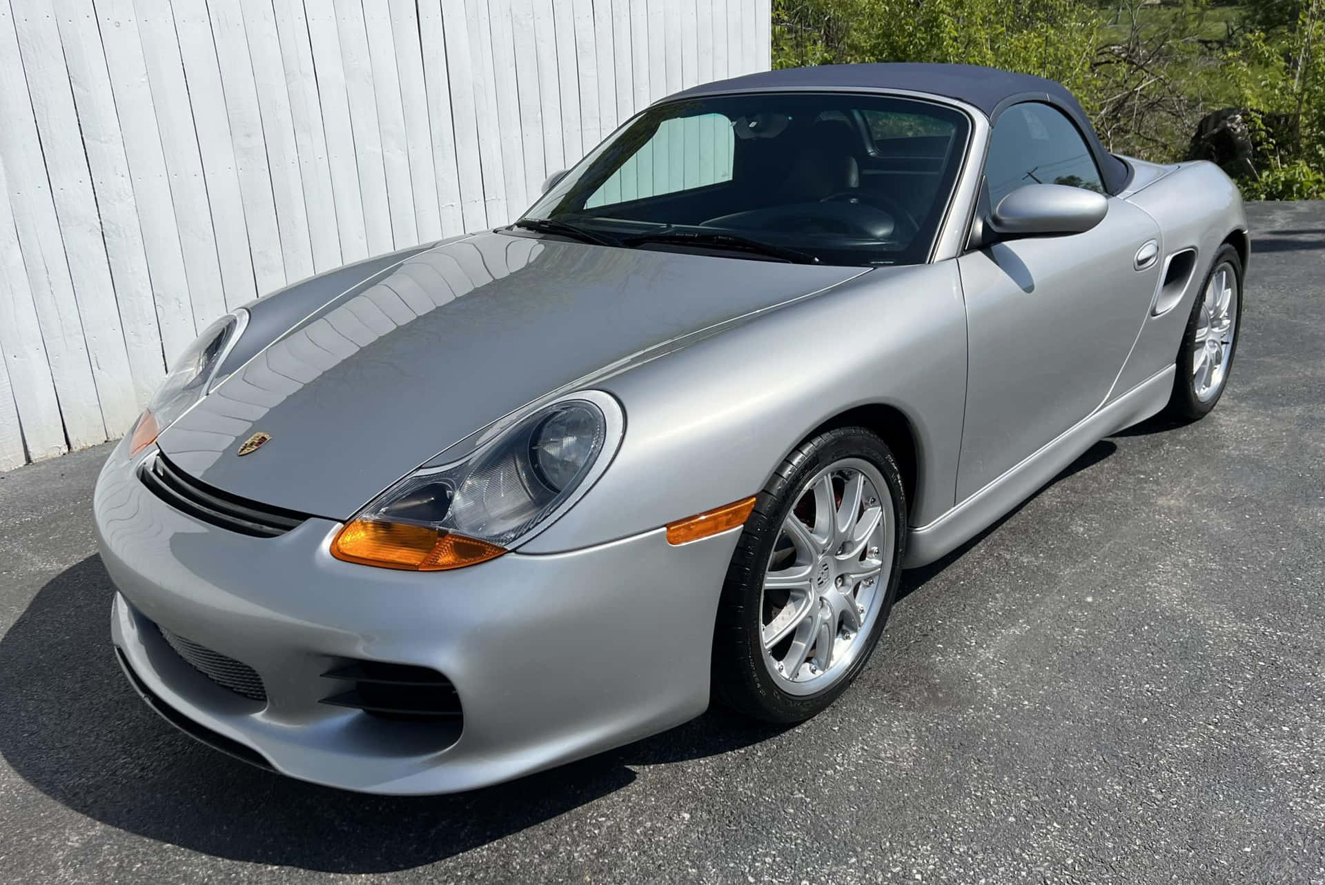 Caption: Luxurious Porsche Boxster Cruising On The Open Road Wallpaper