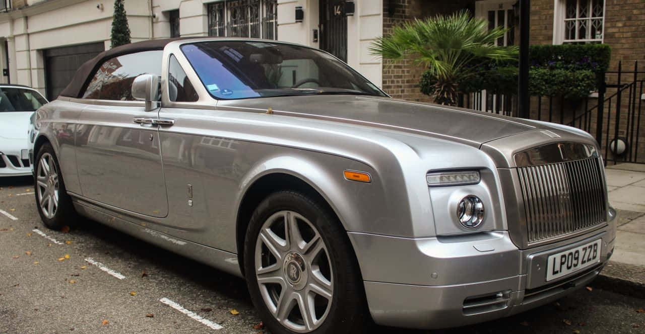 Caption: Luxurious Rolls Royce Phantom Drophead Coupe In Motion Wallpaper