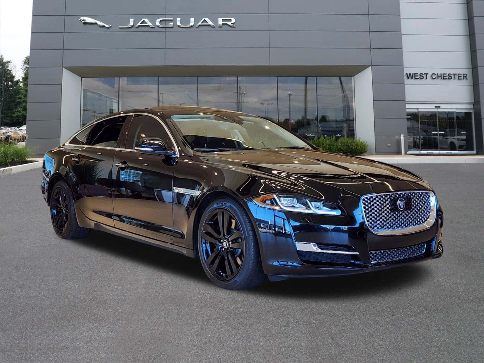 Caption: Luxury In Motion: The Sleek And Elegant Jaguar Xj Wallpaper