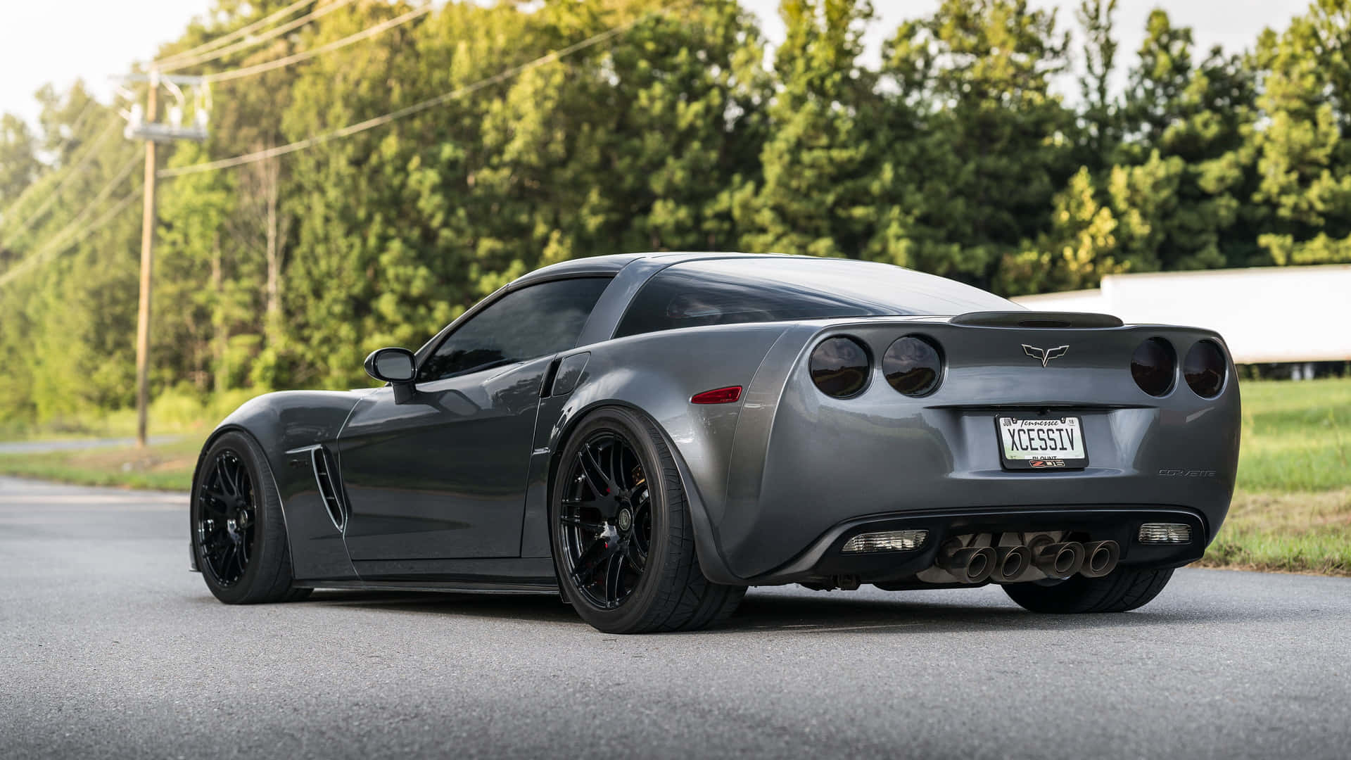 Caption: Majestic Chevrolet Corvette Zr1 Cruising On Highway Wallpaper