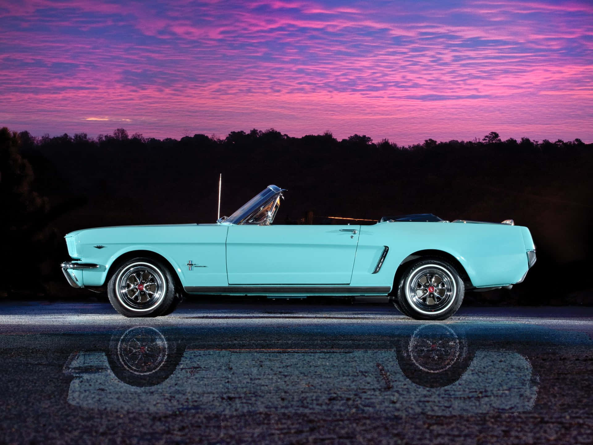 Caption: Majestic Ford Mustang Gt Convertible Cruising In The Sunset Wallpaper