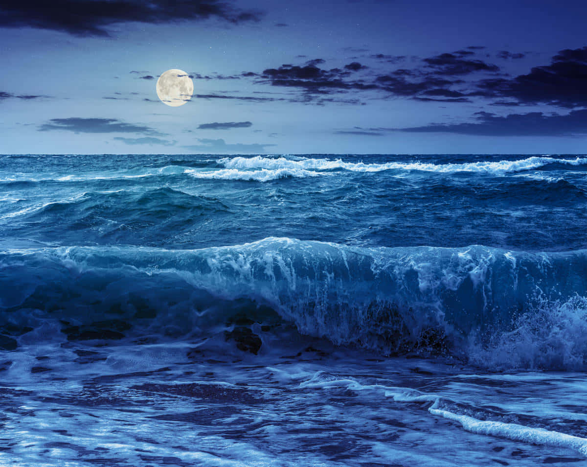 Caption: Majestic High Tide Of The Ocean Wallpaper
