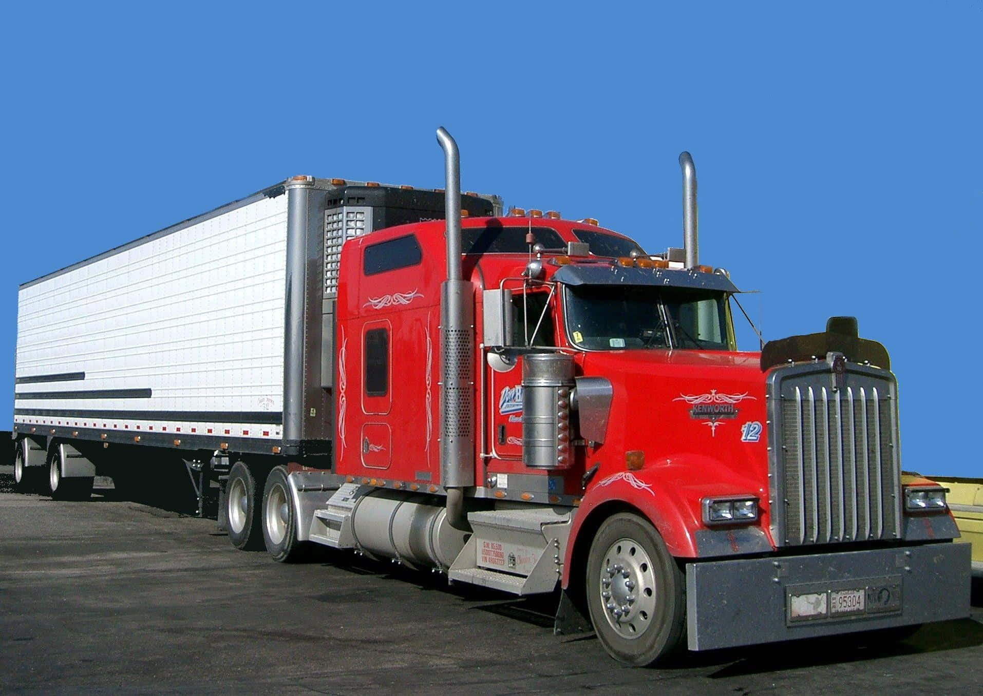 Caption: Majestic Kenworth W990 Under The Clear Sky Wallpaper