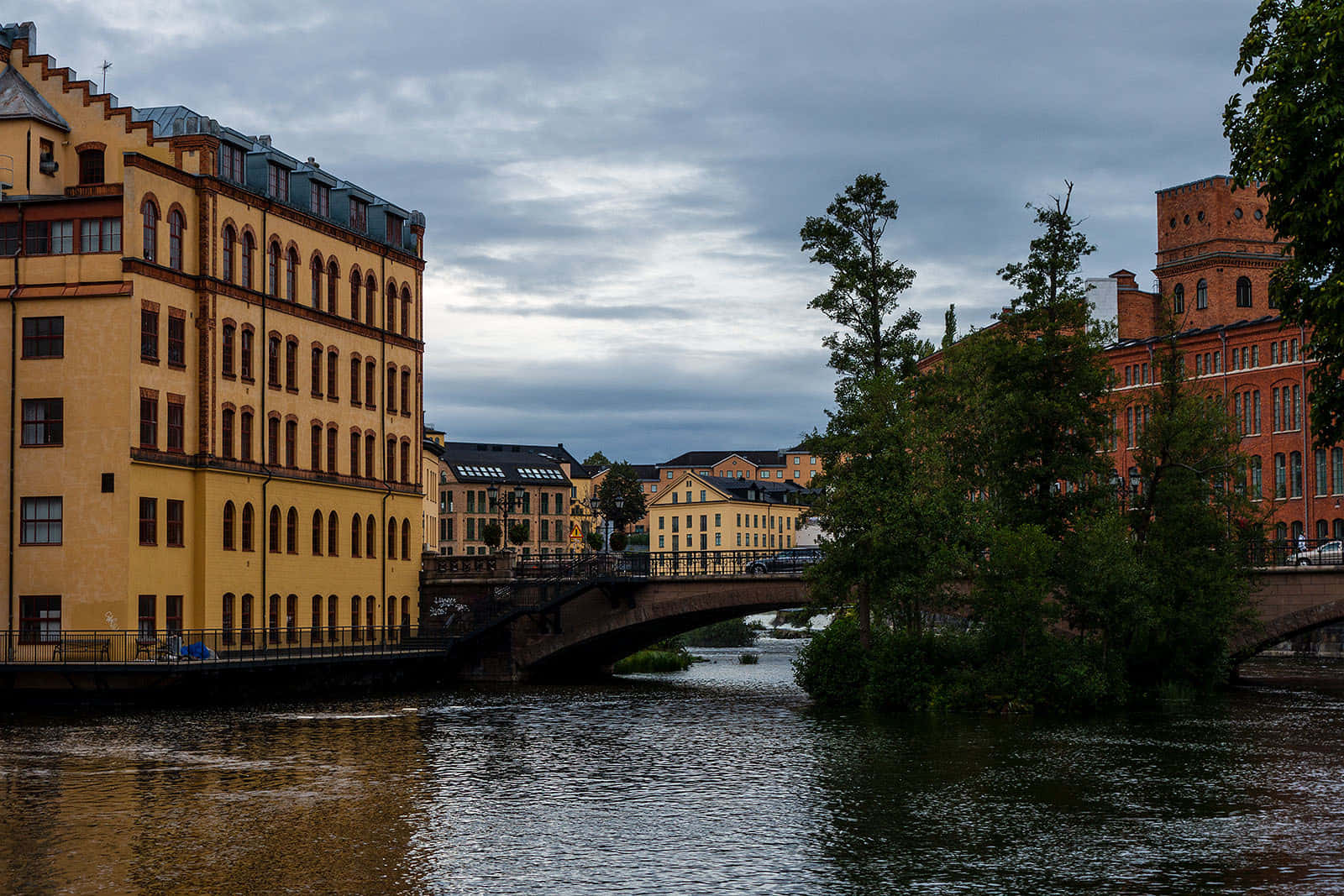 Caption: Majestic Riverside View Of Norrköping Wallpaper