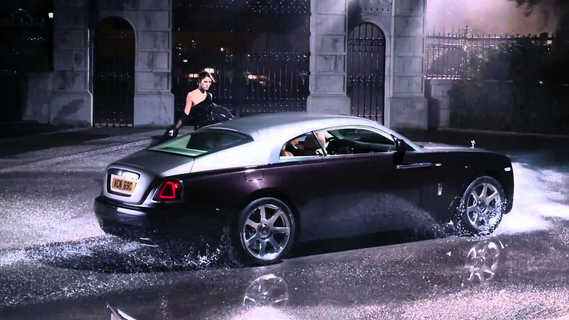 Caption: Majestic Rolls Royce Sweptail Against A Serene Backdrop Wallpaper
