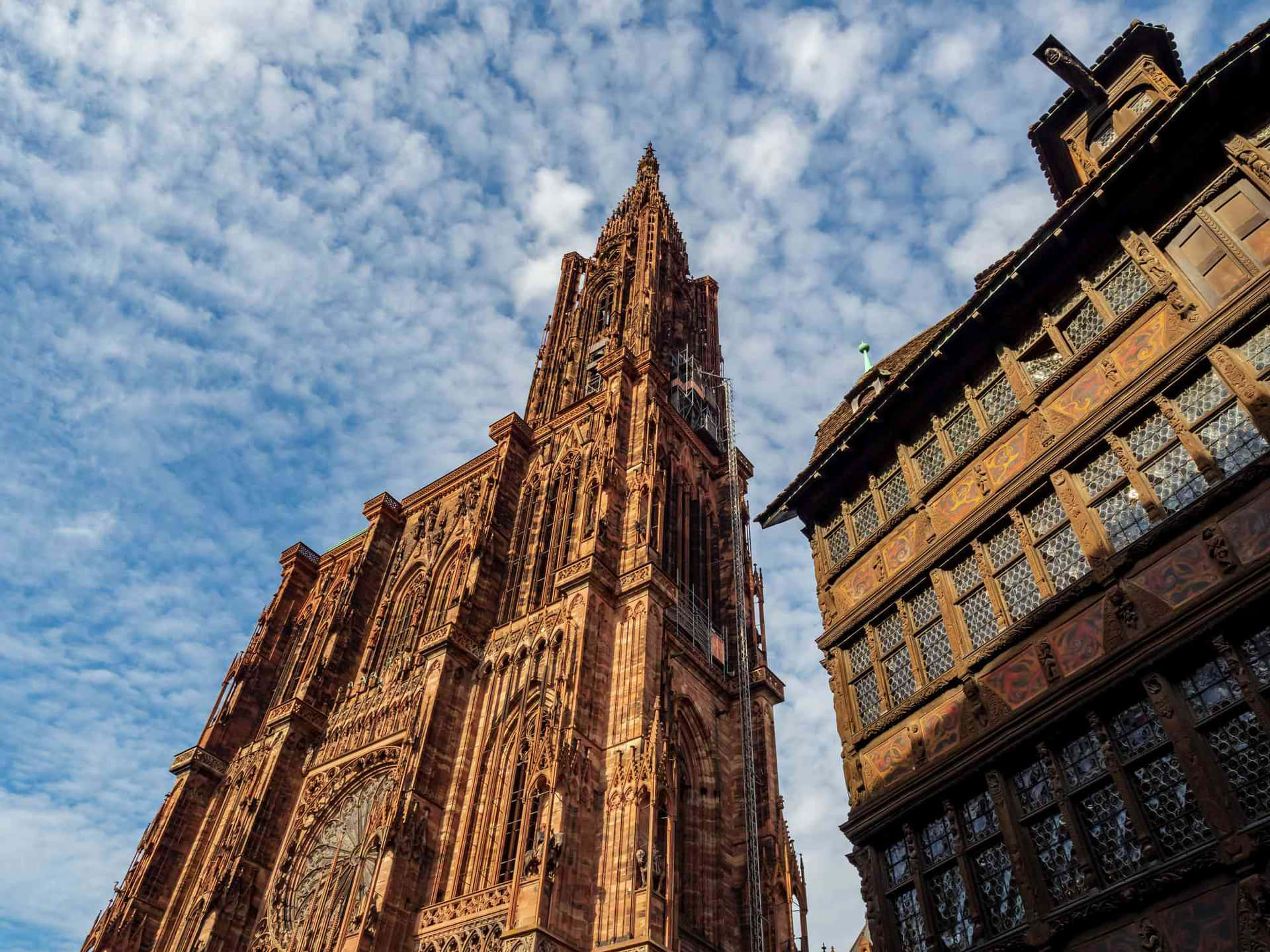 Caption: Majestic Strasbourg Cathedral In France Under A Beautiful Skyline Wallpaper