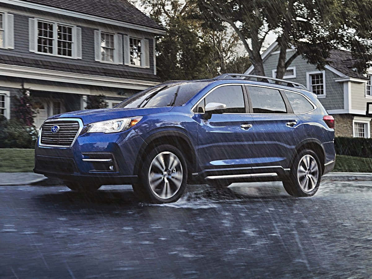 Caption: Majestic Subaru Ascent Driving Through A Serene Countryside Road Wallpaper