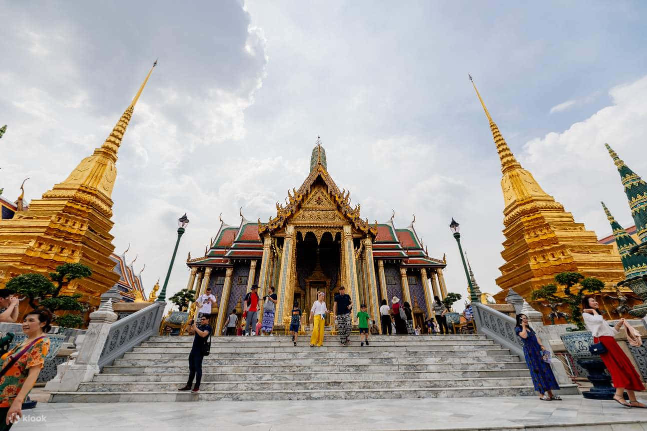 Caption: Majestic View Of The Grand Palace At Dusk, Bangkok Wallpaper