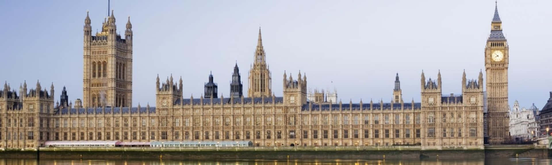 Caption: Majestic View Of The House Of Parliament At Sunset Wallpaper