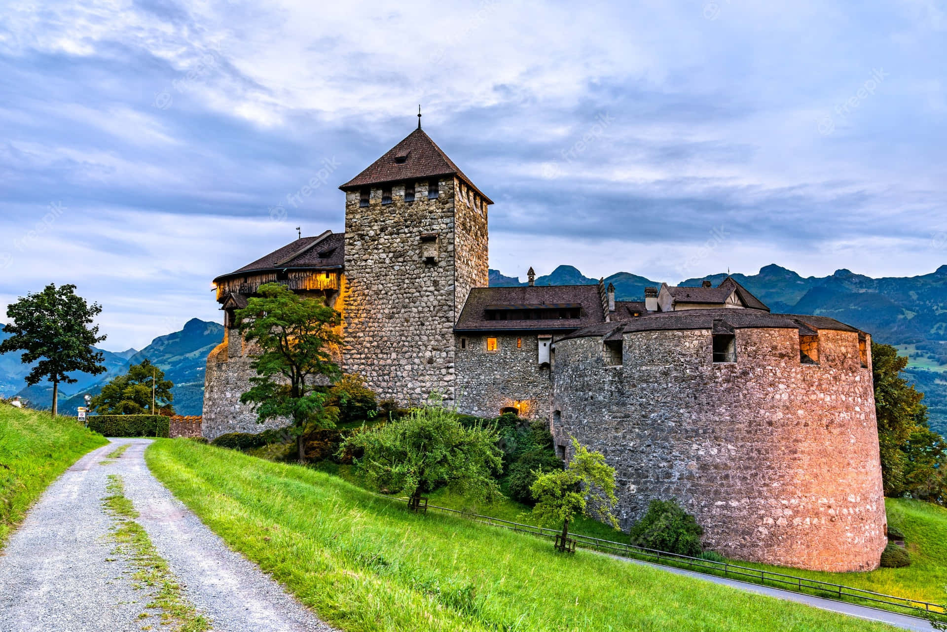 Caption: Majestic View Of Vaduz Castle Against Blue Sky Wallpaper