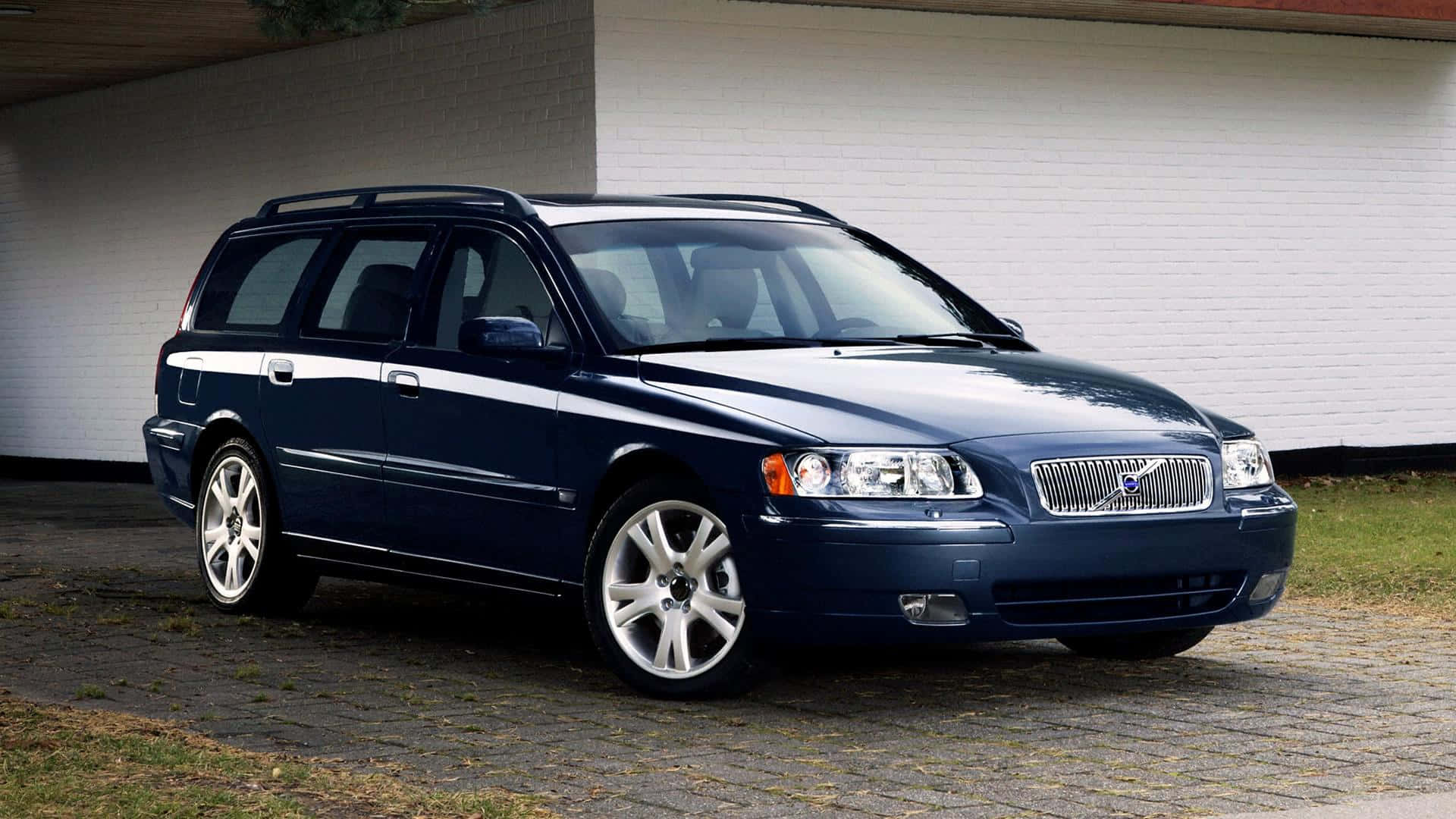 Caption: Majestic Volvo V70 Gliding Down The Road. Wallpaper