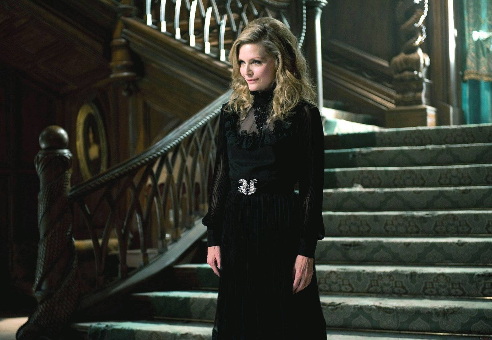 Caption: Michelle Pfeiffer Looking Elegant In A Black Dress Wallpaper
