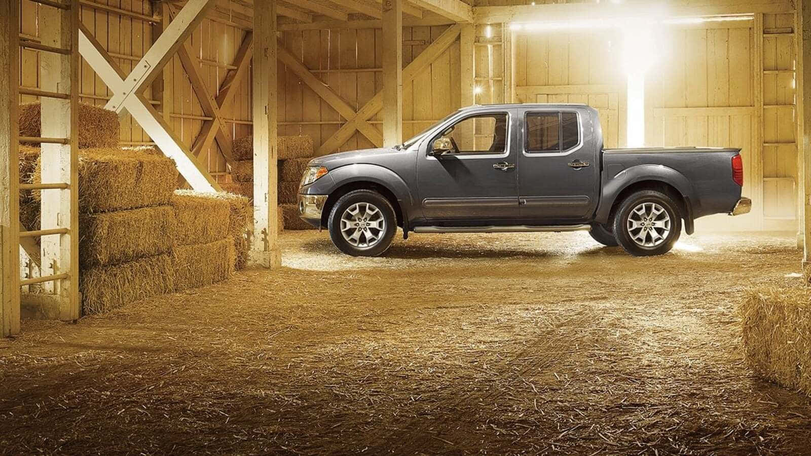 Caption: Nissan Frontier Showcasing Robust Power In The Wilderness Wallpaper