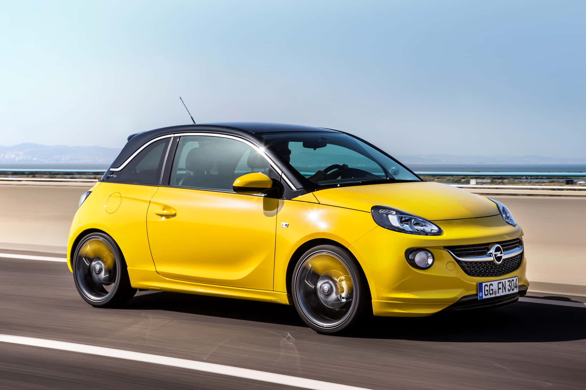 Caption: Opel Adam - Stylish Urban Compact Car Wallpaper