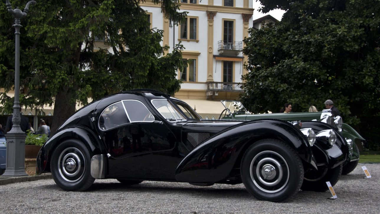 Caption: Picture Perfect - Classic Bugatti Type 57 In Its Prime Wallpaper
