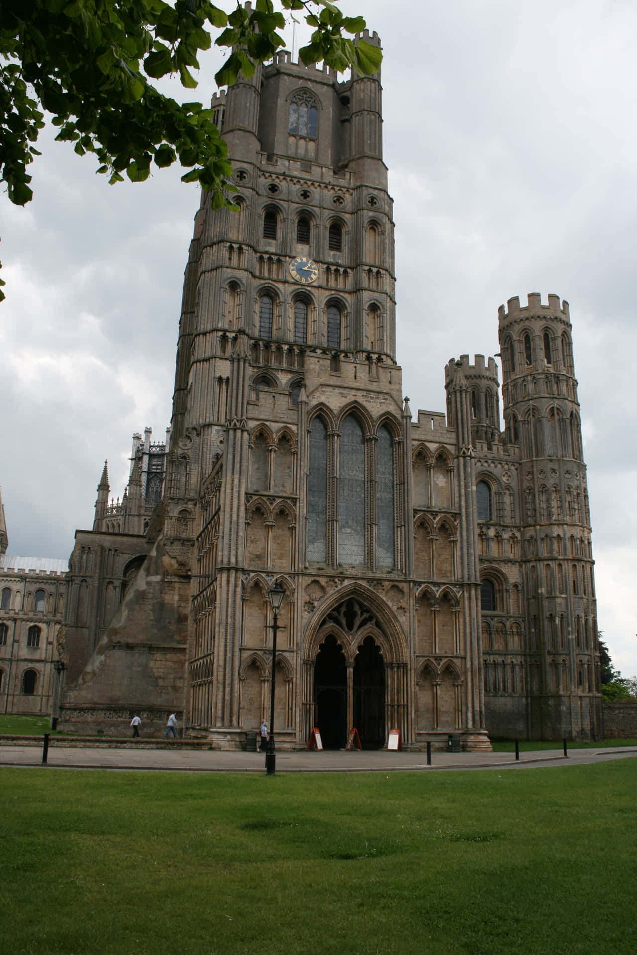 Caption: Picturesque View Of Ely Cathedral On A Serene Day Wallpaper