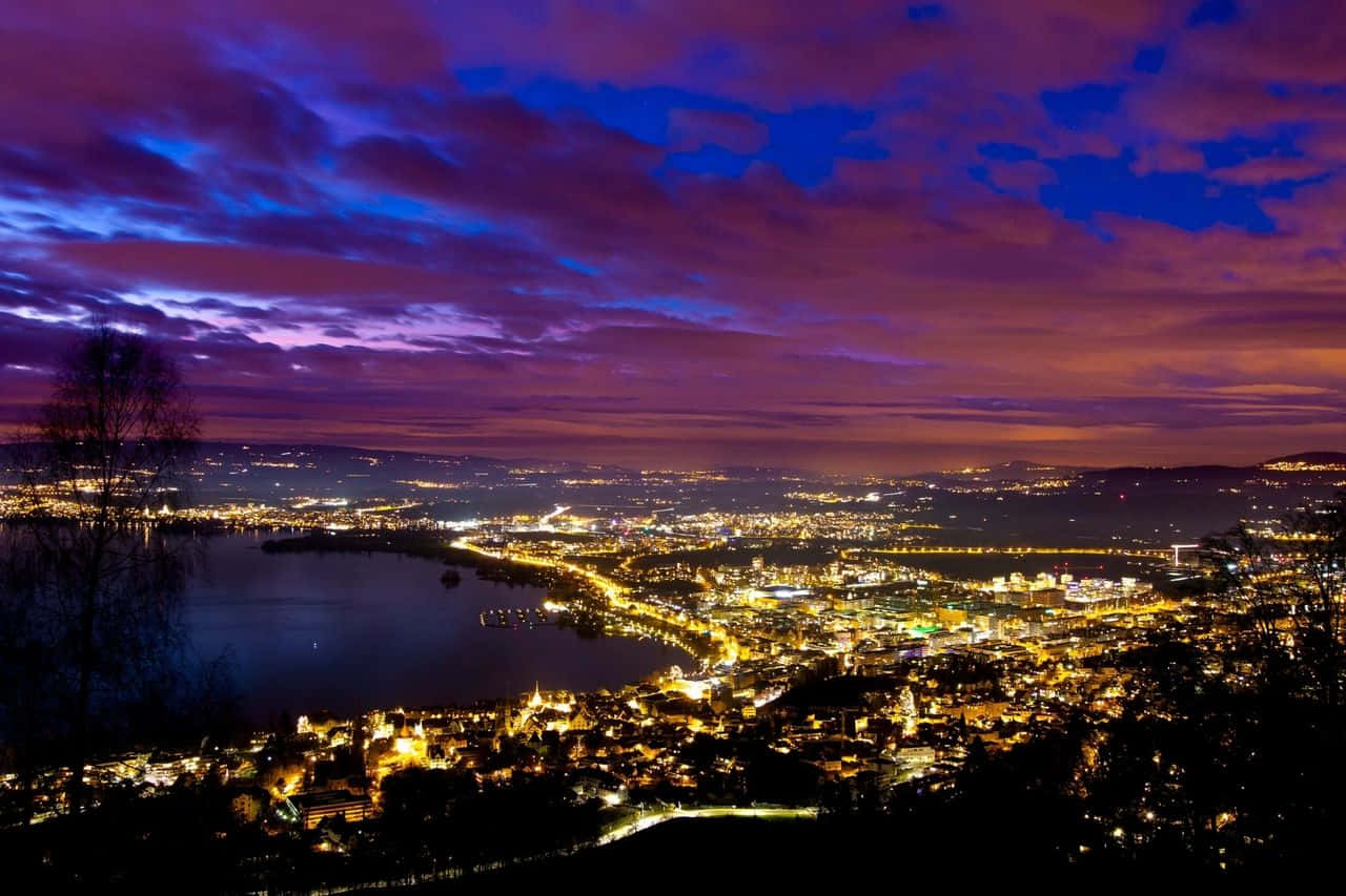 Caption: Picturesque Zug Lake Amidst Swiss Alpine Peaks Wallpaper