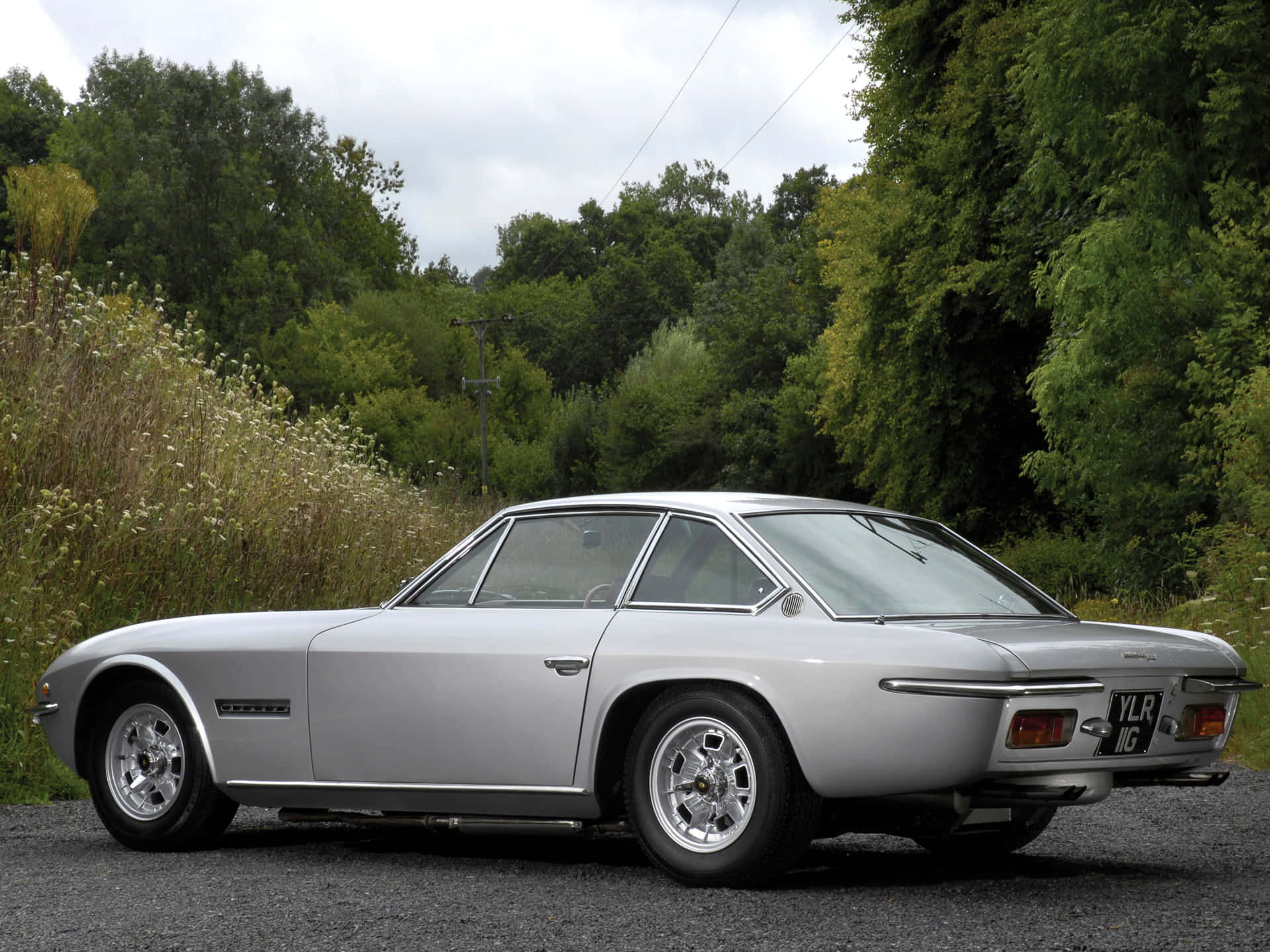 Caption: Power And Beauty - Lamborghini Islero Wallpaper