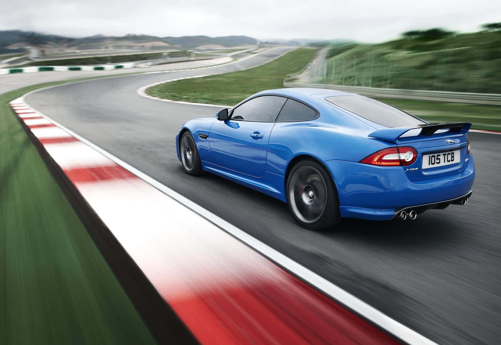 Caption: Power Meets Elegance - Jaguar Xkr-s In Full Glory Wallpaper