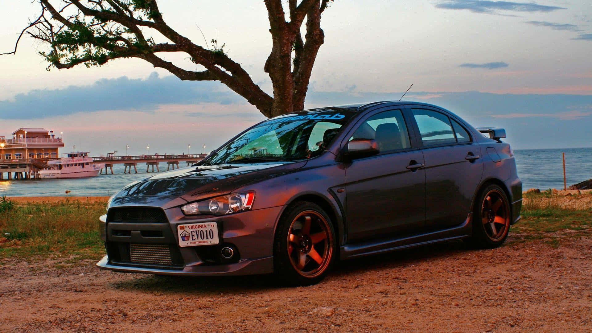 Caption: Power Unleashed: The Mitsubishi Lancer Evolution In Action Wallpaper