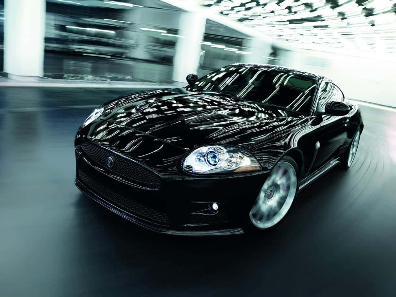 Caption: Powerful Jaguar Xkr-s Ready For Adventure Wallpaper