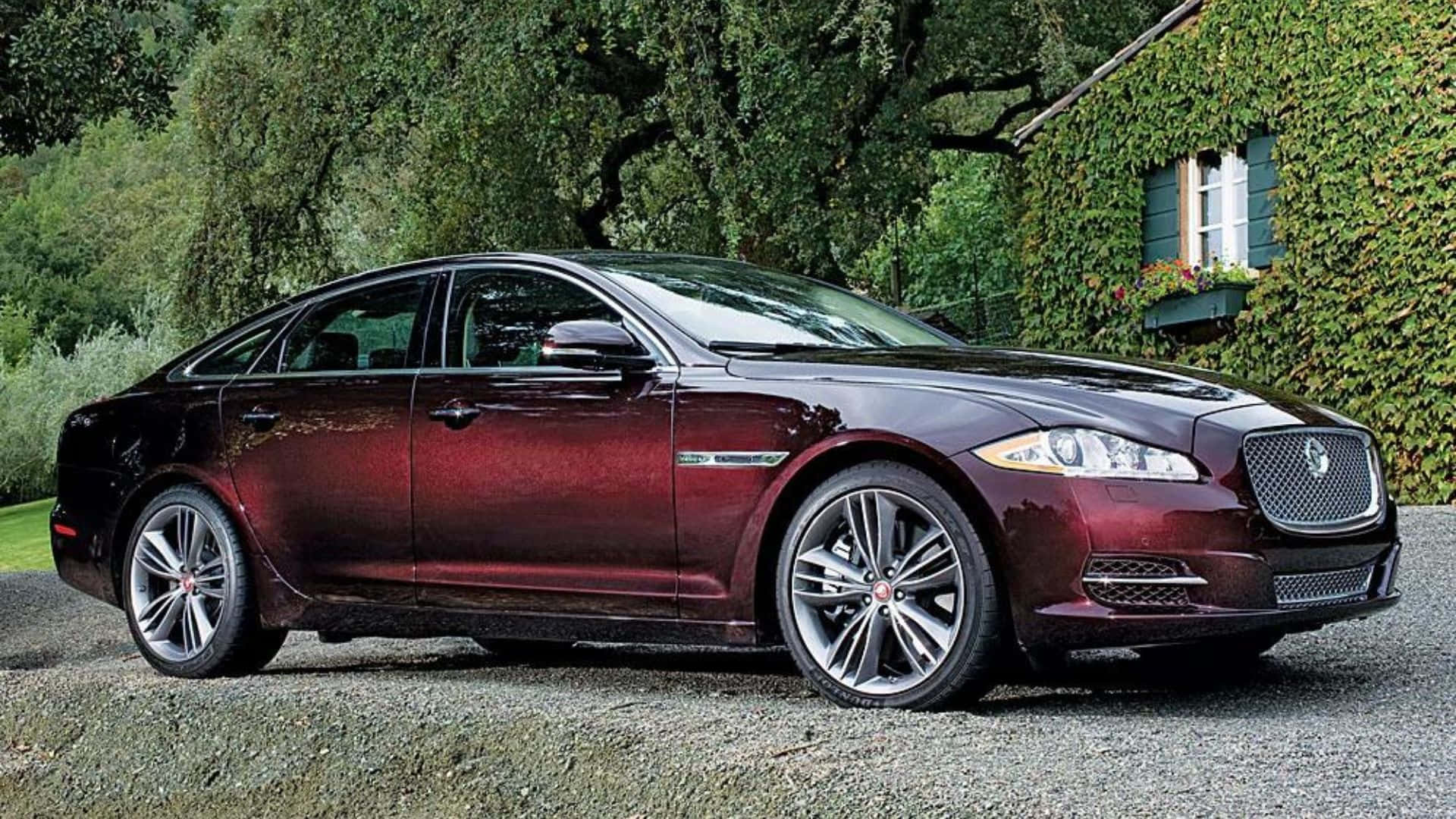 Caption: Powerful Performance And Luxury - The Jaguar Xj Wallpaper