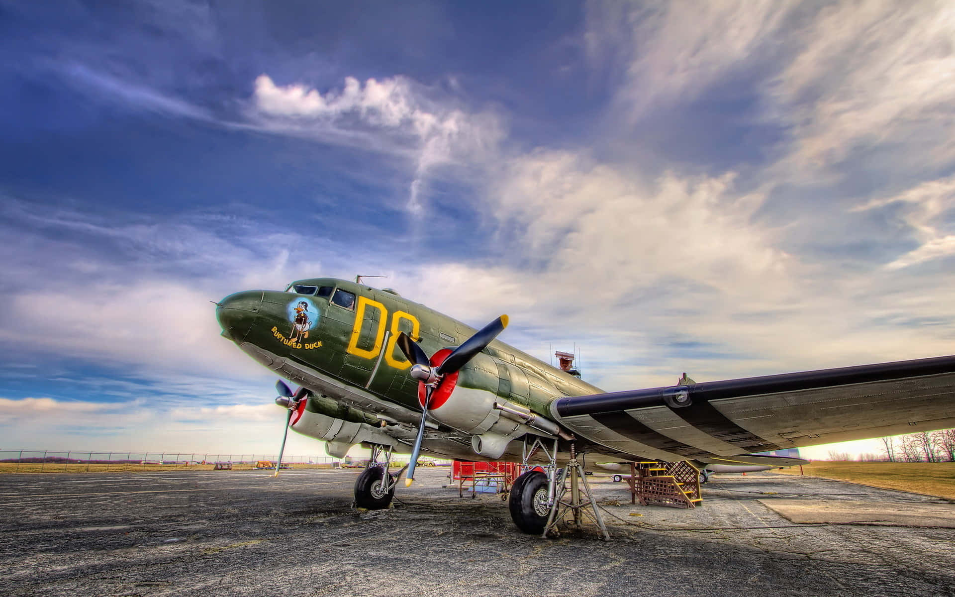 Caption: Pristine Vintage Airplane Soaring The Sky Wallpaper