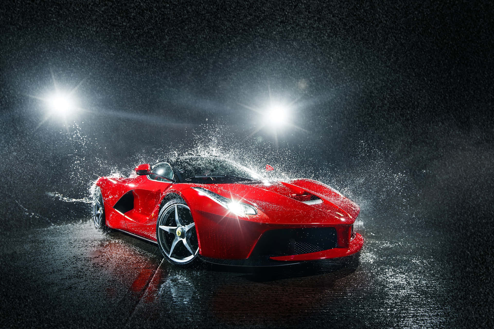 Caption: Red Car Experiencing Top-notch Detailing In Rain Wallpaper