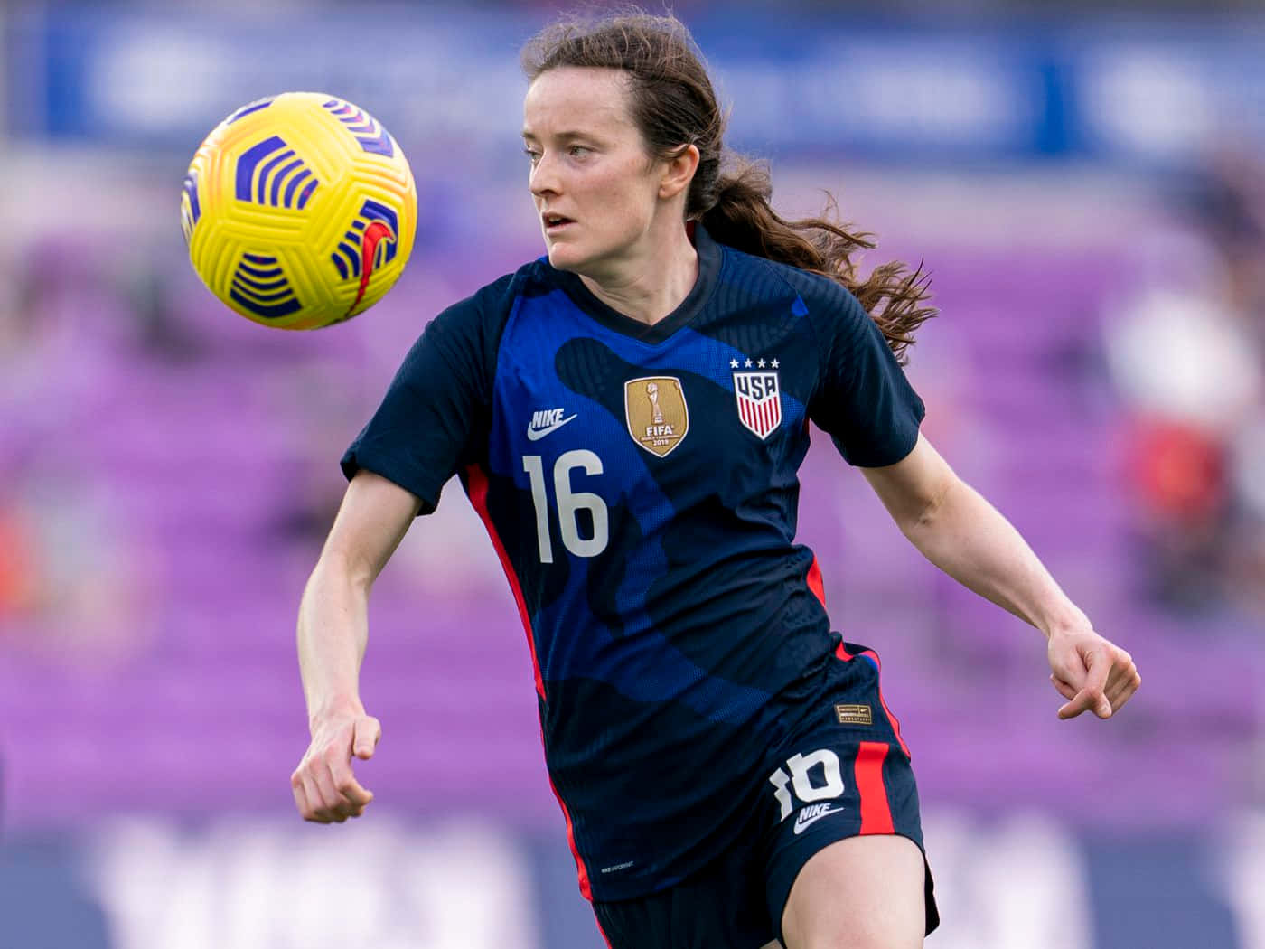 Caption: Rose Lavelle In Action On The Soccer Field Wallpaper