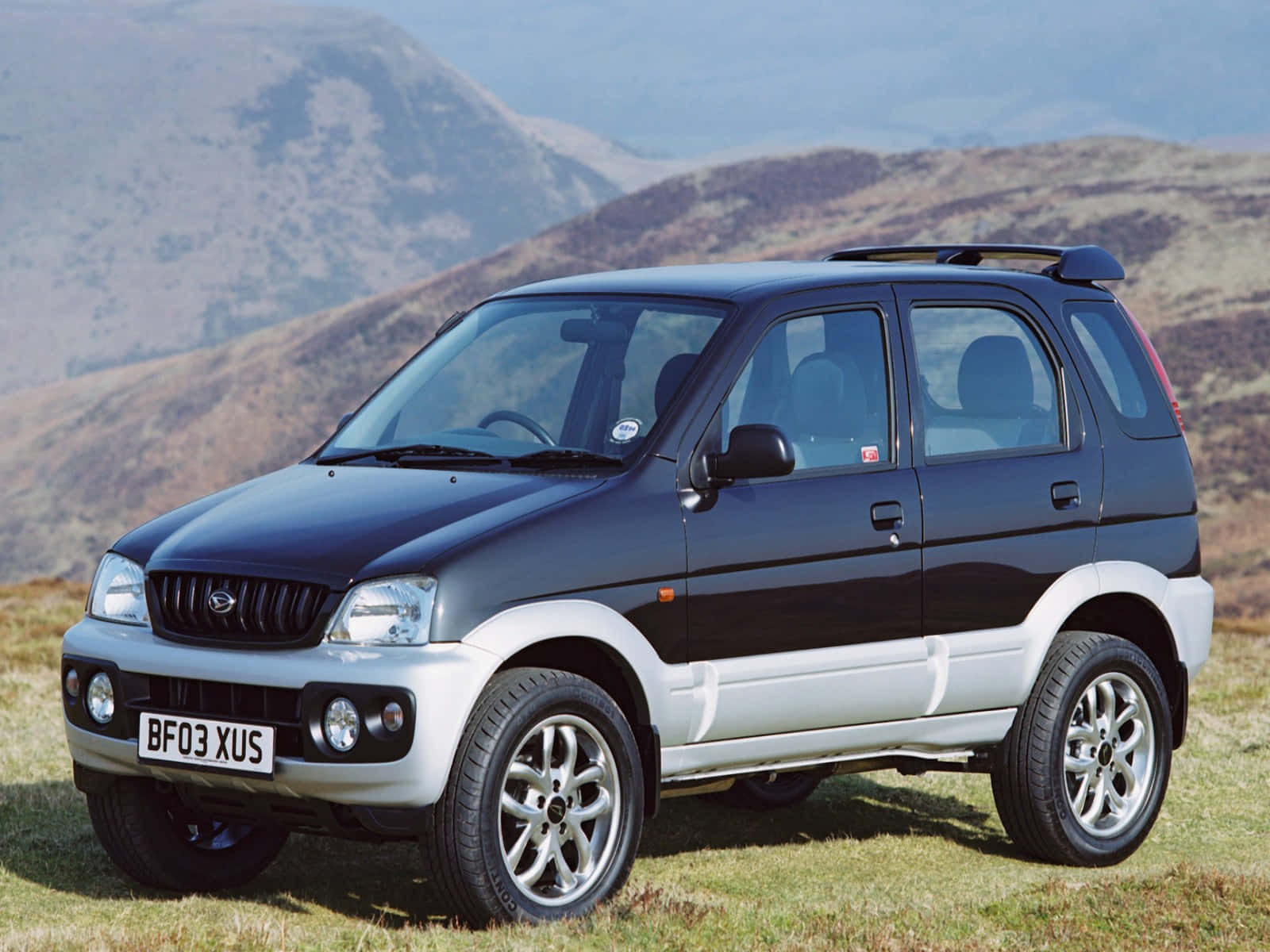 Caption: Rugged Daihatsu Terios In Off-road Adventure Wallpaper