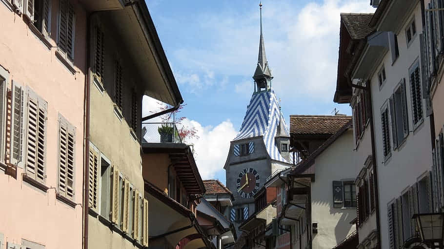 Caption: Scenic View Of Zug City With Its Stunning Lake Wallpaper