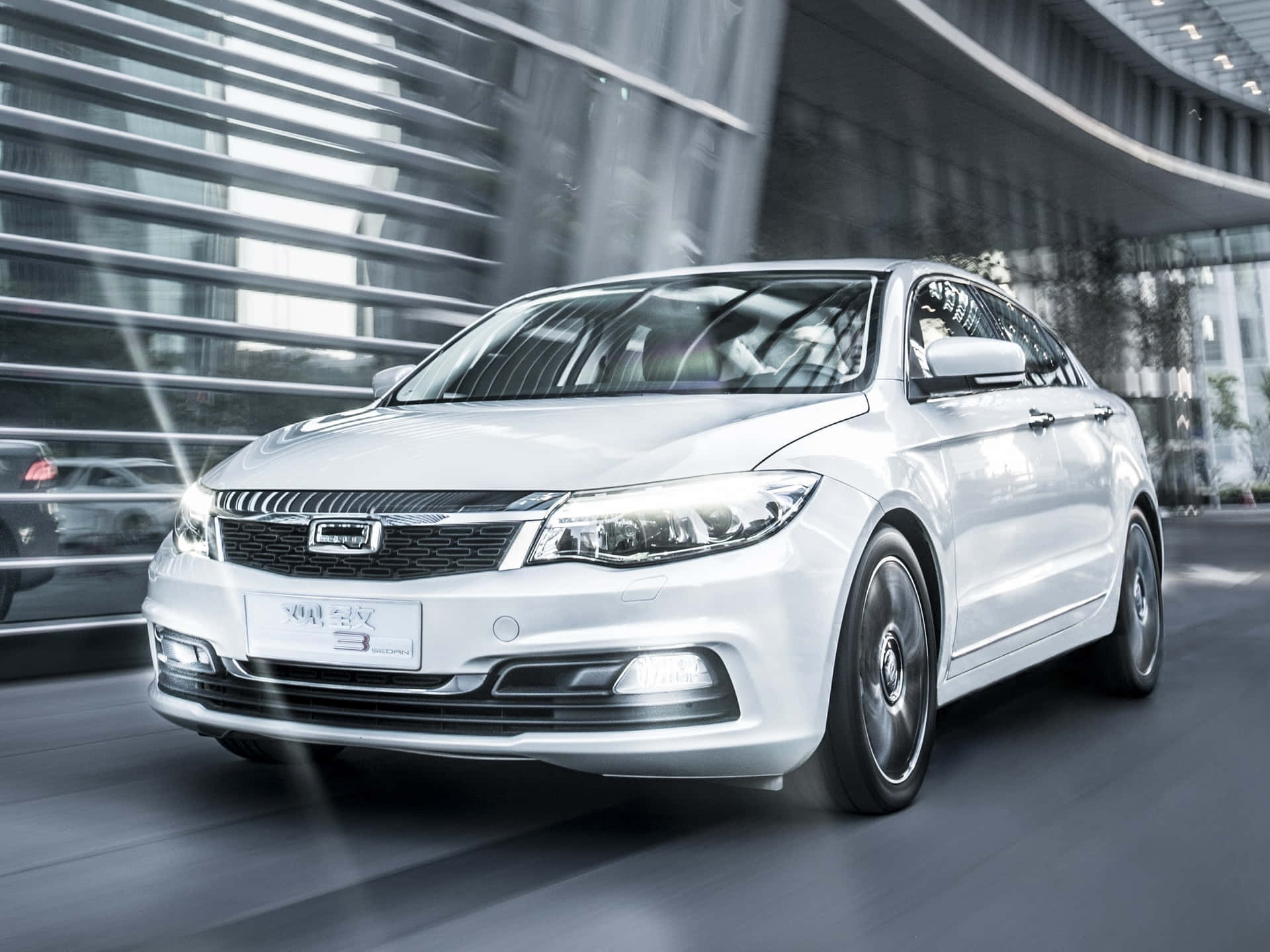 Caption: Sleek And Modern Qoros 3 Sedan Parked On A City Street Wallpaper