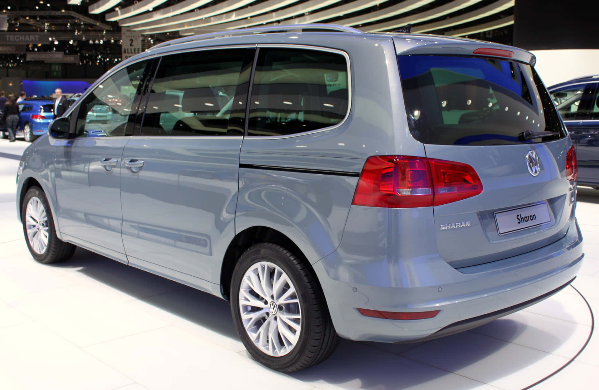Caption: Sleek And Modern Volkswagen Sharan Parked By The Water Wallpaper
