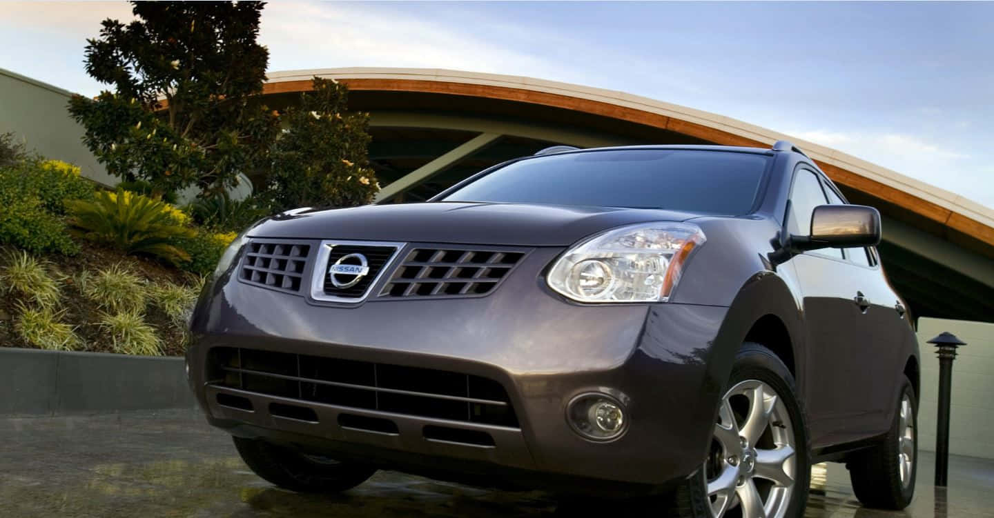 Caption: Sleek And Powerful Nissan Rogue In Its Element Wallpaper