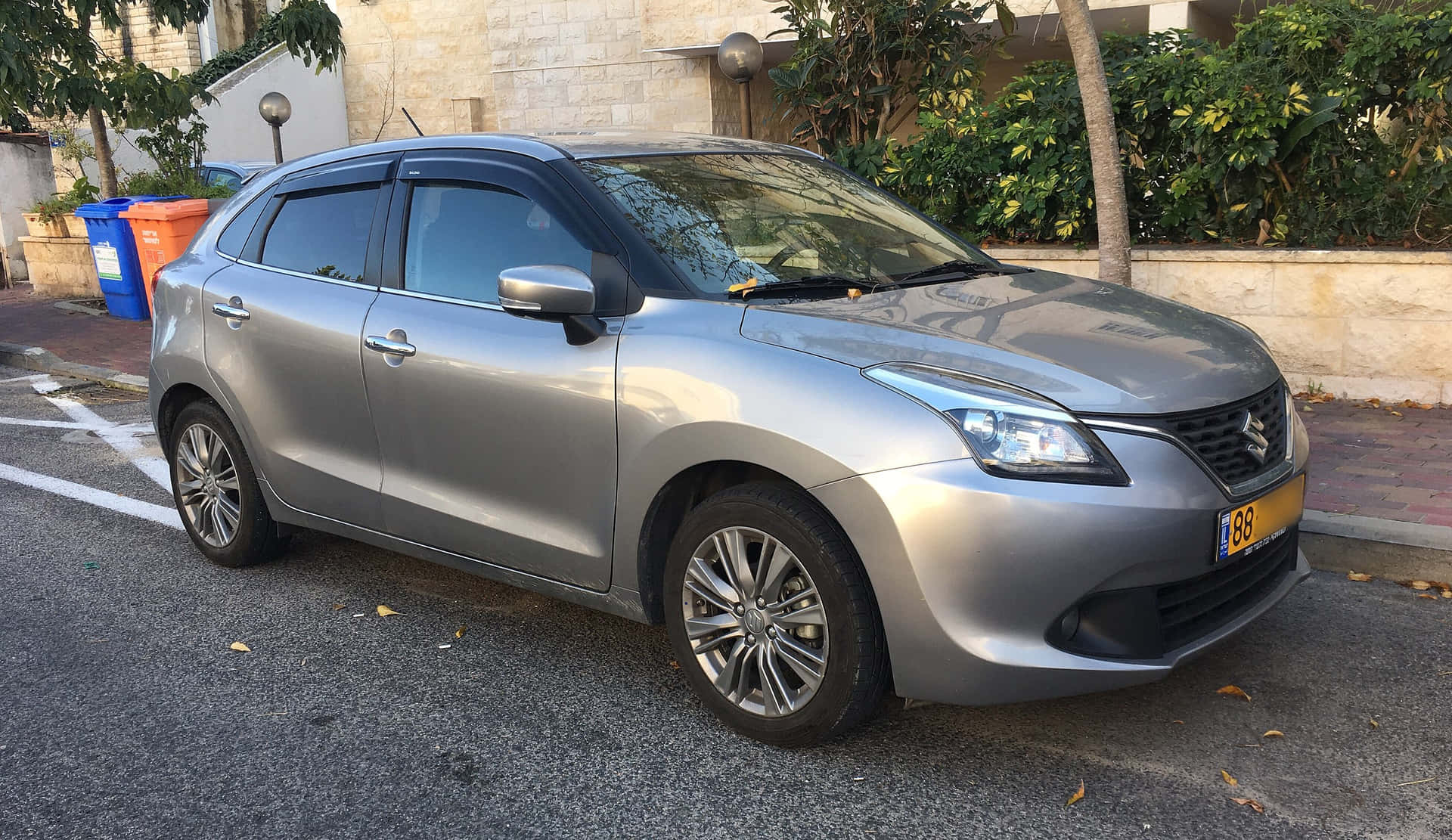 Caption: Sleek And Sophisticated - Suzuki Baleno In Motion Wallpaper