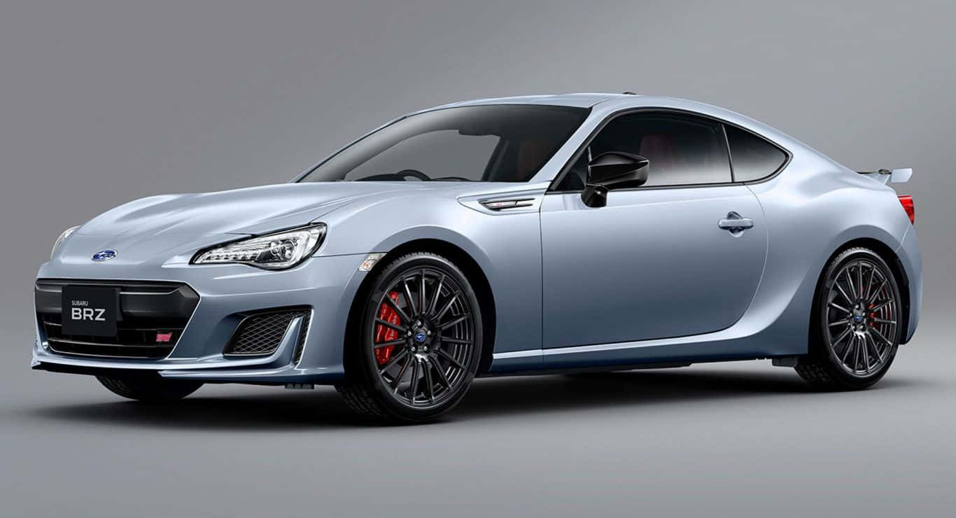 Caption: Sleek And Sporty Subaru Brz Car In Action Wallpaper