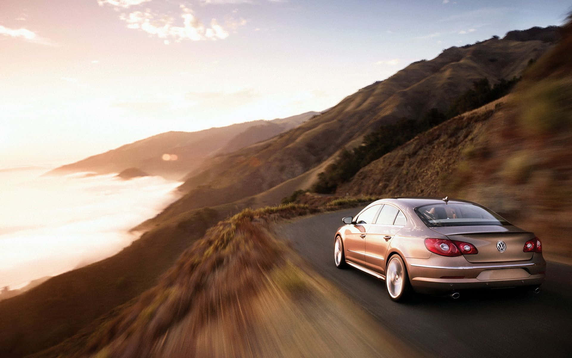 Caption: Sleek And Stylish Volkswagen Passat Cc Glistening Under The City Lights Wallpaper